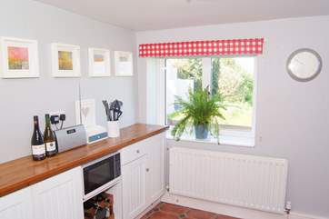 You can see the sea from the kitchen which is at the back of the cottage with a door straight out onto the rear garden with its incredible views.
