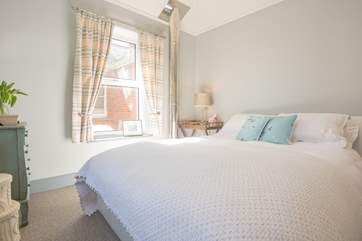 This bedroom is bright and airy with a cosy feel....