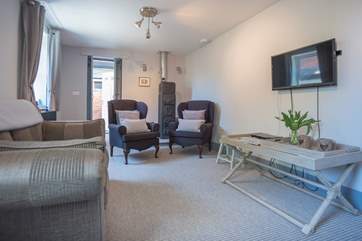 Comfortable sitting-room with a stunning wood-burner