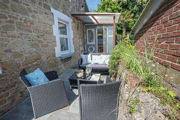 The lovely patio area is a great place to sit outside and enjoy the sunshine