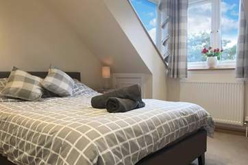 Natural light floods into the bedrooms on the top floor.
