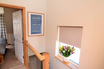The open stairs allow light throughout the house.
