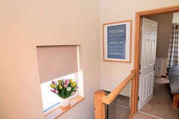 The stairwell allows light to flood the property.