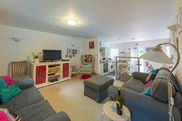 The ground floor is open plan, there are two steps down to the kitchen from the sitting-area.