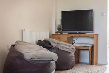 Snuggle down on the beanbags in the snug area.