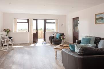 The open plan living space is flooded with natural light.