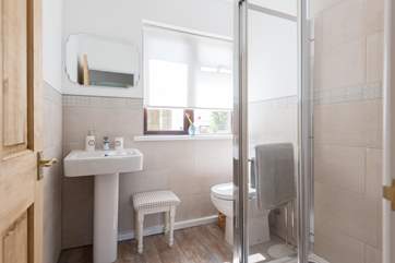 The family shower-room has a large walk-in shower.