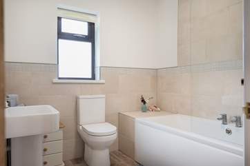Enjoy a bubble bath in the family bathroom.