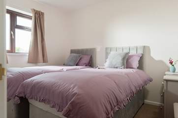 This bedroom looks out over the quiet back garden.
