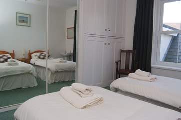 The twin bedroom has plenty of storage space.