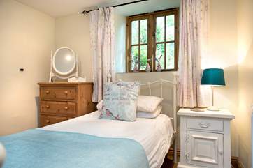 Single bedroom 2 has a pretty bedstead.