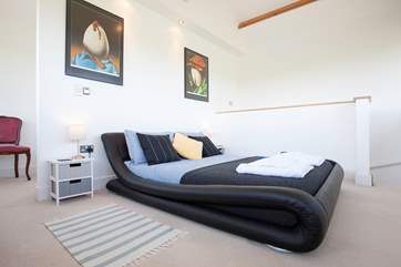 The master bedroom on the third floor has a large en suite wet-room