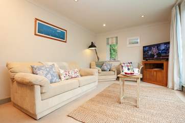 Relax in the cosy sitting-room with sliding doors out to the balcony