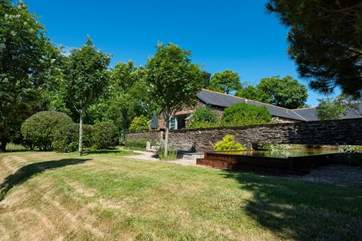 The lawned area in front of the barn.
