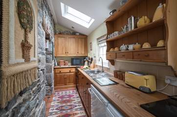 This well-equipped kitchen has everything you will need to whip up a feast. The kitchen also has direct private access to the patio, making dining al fresco extremely easy.