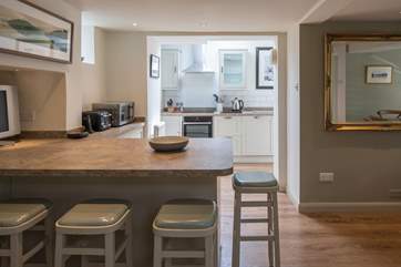 The breakfast-bar, equipped with a second TV, makes a great spot to enjoy a spot of cereal whilst catching up with the early morning news.