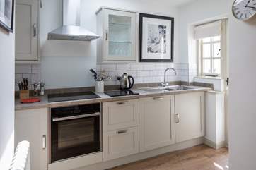 The kitchen is carefully designed and fully equipped to make whipping up a feast a doddle.