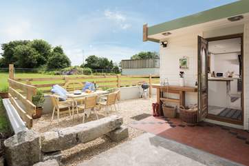 Soak up the rays in the garden. There is a hot water shower for your muddy dogs.