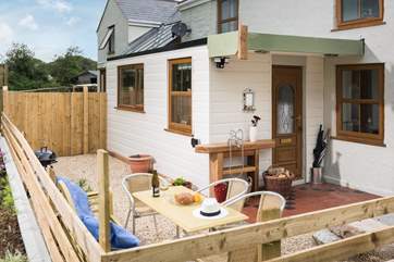 The main door from the house leads straight out onto the outside eating area and garden.
