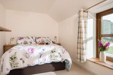 The bedrooms overlook the garden and fields.