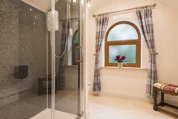 There is a large luxurious shower.