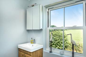 The shower-room enjoys views over the Cornish countryside.