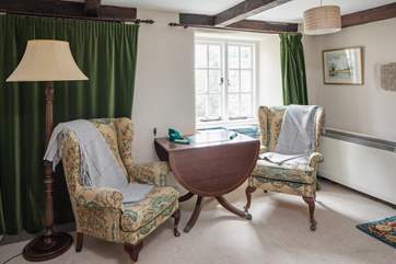 The sitting-room has a delightful breakout space to play a board game or read a book in the light which shines through.