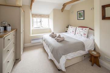 Bedroom 1 is super comfy and welcoming.