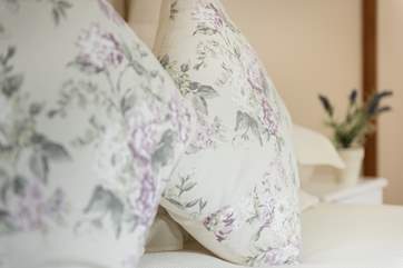 Pretty florals and white linens throughout.