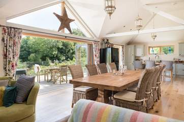 Fold back the bi-fold doors and let the outside in.