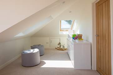 The family room has been carefully designed to offer all members of the party 'that special space'. A TV is being placed on the wall behind the toys, which will make this snug area a brilliant place