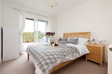 One of the ground floor bedrooms, both doubles have doors leading out to the patio.