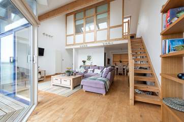 Stairs lead up to the single bedroom/snug on the second floor.