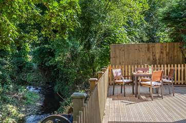 The outside decked area, overlooks the river.