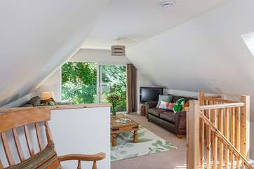 The cosy sitting-room is located on the first floor and the Juliet balcony overlooks the river (please supervise children at all times)