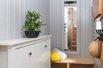 Tucked away at the bottom of the stairs is the little boot-room, simply perfect for muddy boots to be left and sandy paws to be wiped.
