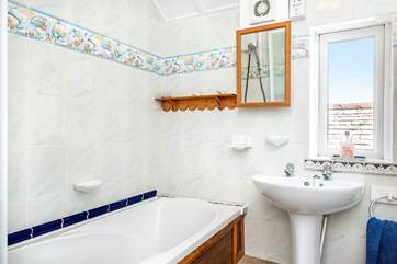 The bathroom also has a fitted shower over the bath.