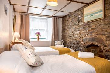 The twn bedroom is at the front of Haywain - it retains much of its original charm with the exposed wall.