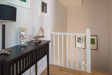 The stairs lead up into this lovely hallway area.
