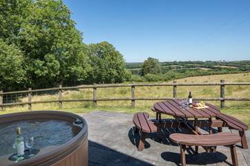 Enjoying a glass of something tasty whilst soaking up this view in your bubbling hot tub is unbeatable.