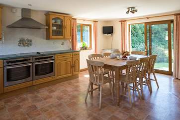 The kitchen is extremely spacious and well-equipped.