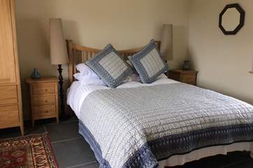 The ground floor bedroom with a king-size double bed and an en suite shower-room.