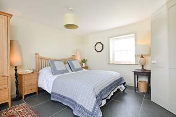 The ground floor bedroom with a king-size double bed and an en suite shower-room.