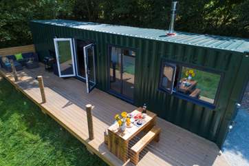 Relax and enjoy this fabulous setting in this beautifully and uniquely converted shipping container.