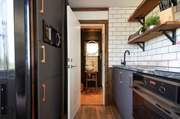 At the other end is the en suite shower-room, again beautifully finished,
