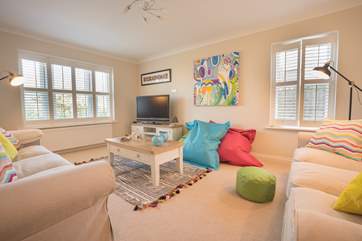 The sitting-room is furnished and decorated to a high standard
