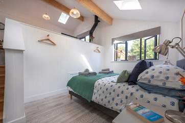You enter on the ground floor of this split level cabin into the glorious bedroom with king-size bed.