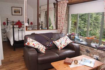 The bedroom-area looks onto the sitting-area.