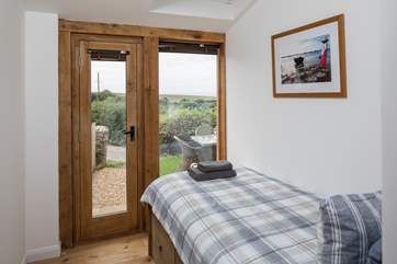 The ground floor twin bedroom is exceptionally cute and airy. Again, with the loveliest of views.