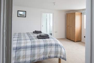 The master bedroom leads through to the en suite.